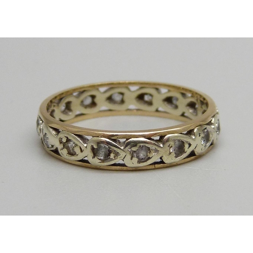 1057 - A 9ct gold eternity ring, 2.9g, R