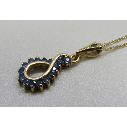 1099 - A 9ct gold and sapphire pendant and chain, 2.9g