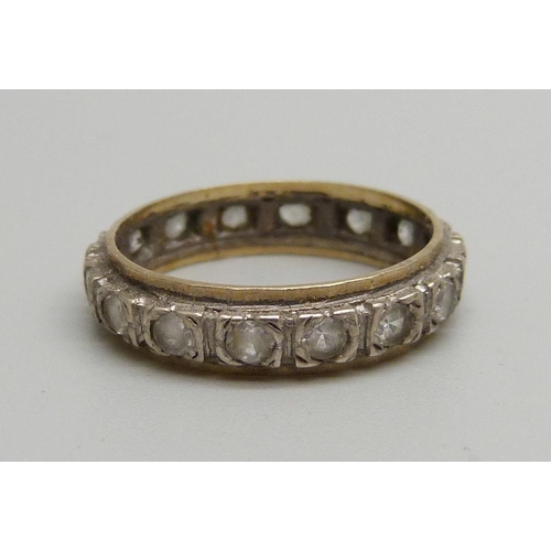 1102 - A 9ct gold and silver eternity ring, L