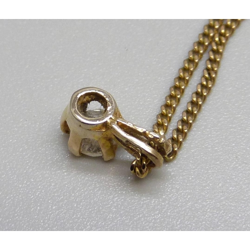 1106 - A 9ct gold and diamond pendant on a 9ct gold chain, 2.5g