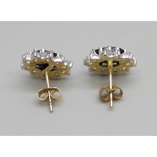 1116 - A pair of cubic zirconia and sapphire earrings, 2.2g, the butterfly fasteners marked 9ct