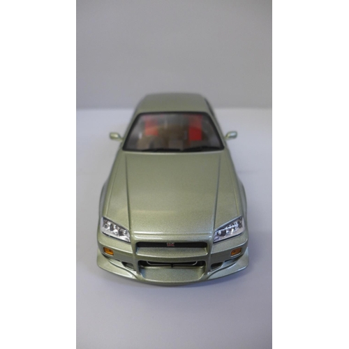 602 - An Artisan Collection 1999 Nissan Skyline GT-R R34 model vehicle, boxed