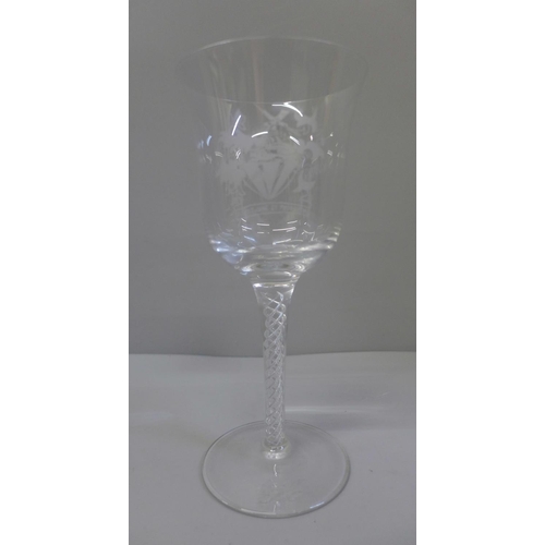 608 - A Masonic glass wine goblet with applied symbols and Courage and Prudence in Latin, monogram to base