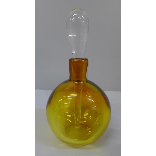 632 - A heavy amber glass perfume bottle, etched mark to base