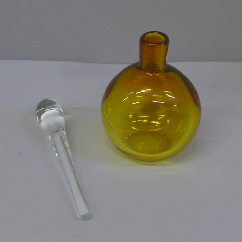 632 - A heavy amber glass perfume bottle, etched mark to base