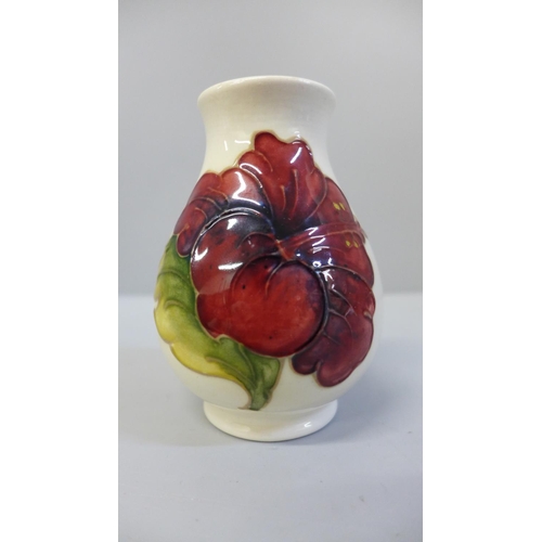 645 - A Moorcroft hibiscus vase, 9.5cm