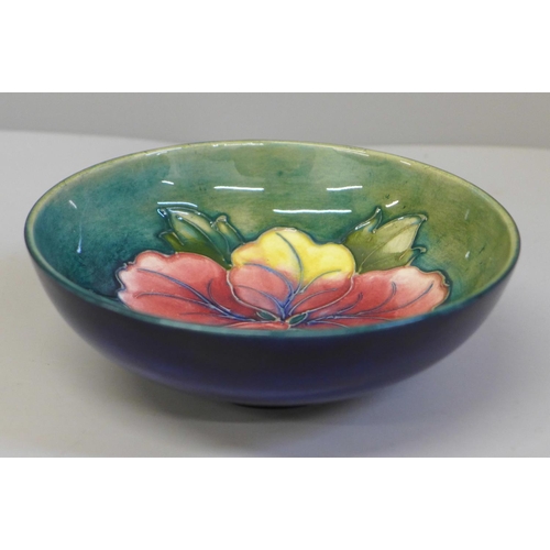 651 - A Moorcroft hibiscus blue and green bowl, 14cm