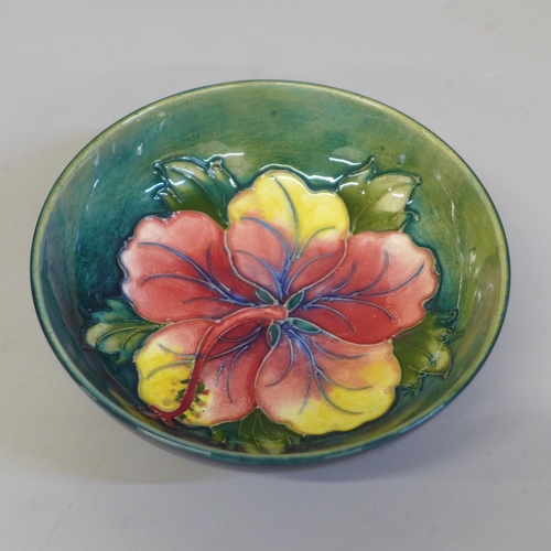 651 - A Moorcroft hibiscus blue and green bowl, 14cm