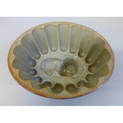 665 - A Victorian salt glaze jelly/aspic mould with lion detail