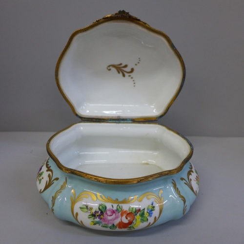 666 - A Limoges pot, signed Decor Main, with gilt metal hinge