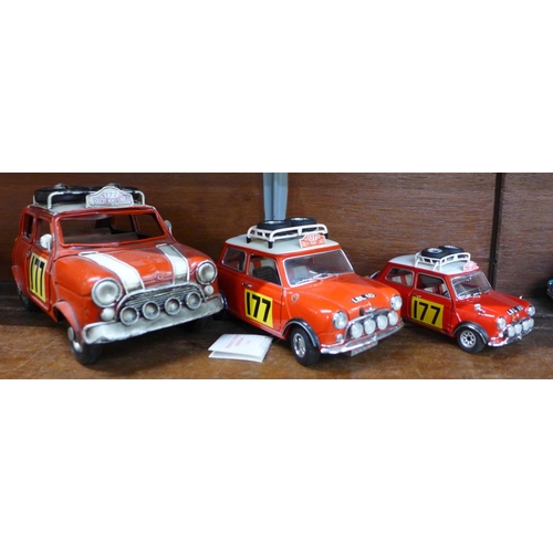 669 - Three models of the 1960's Morris Mini Cooper Monte Carlo winning car, a tin plate model, a Corgi an... 