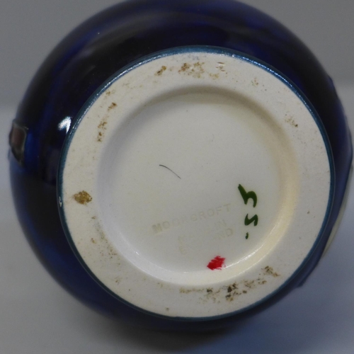 671 - A small Moorcroft vase, 9.5cm