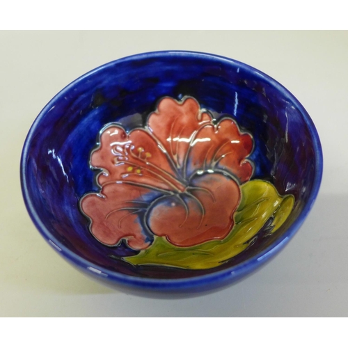 673 - A small Moorcroft hibiscus bowl, 10.5cm