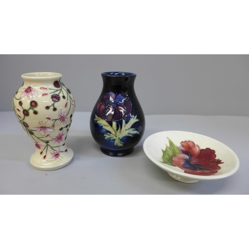 675 - Three items of Moorcroft:- two miniature vases and a trinket dish