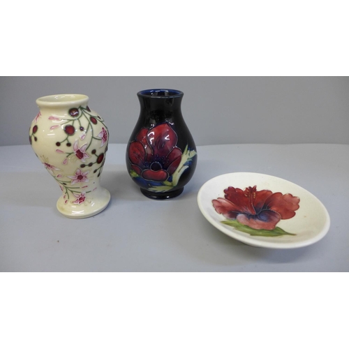 675 - Three items of Moorcroft:- two miniature vases and a trinket dish