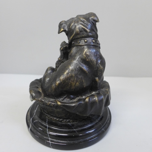 676 - A bronze model of two dogs in a basket, after Giuseppe Onway