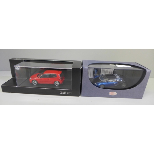 680 - Two die-cast model vehicles; a VW Dealership Golf GTI and a Bugatti, both boxed