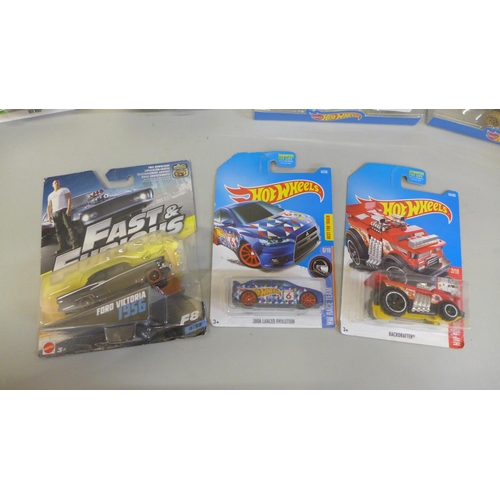 690 - Five Hot Wheels model vehicles and two Mattel Fast and Furious and Star Wars, all packaged