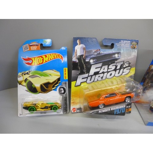 690 - Five Hot Wheels model vehicles and two Mattel Fast and Furious and Star Wars, all packaged