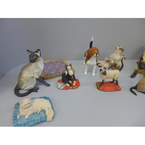 698 - A collection of cat figures and a Beswick dog