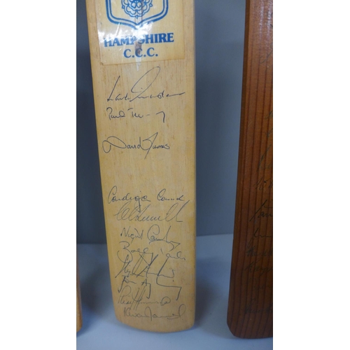 725 - Five souvenir miniature cricket bats, signed by international teams and country teams; MCC Hong Kong... 