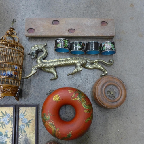 737 - A collection of oriental items; brass dragon on a wooden plinth, bird cage, two terracotta pots, scr... 