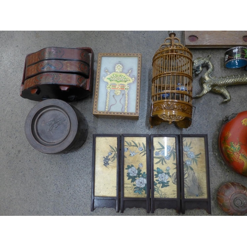 737 - A collection of oriental items; brass dragon on a wooden plinth, bird cage, two terracotta pots, scr... 