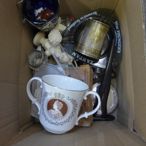 748 - A mixed lot of silver plate, pipes, advertising items and other items