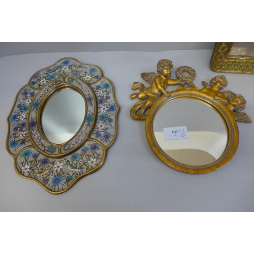 774 - Three mirrors, brass fronted, gilt example depicting cherubs and one other