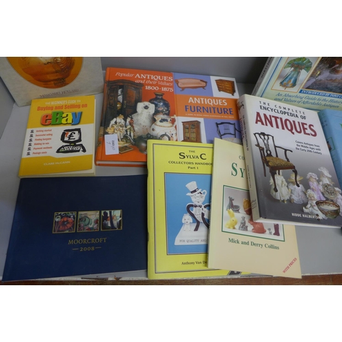 797 - A collection of books including antiques guides, Moorcroft, Sylvac, etc.