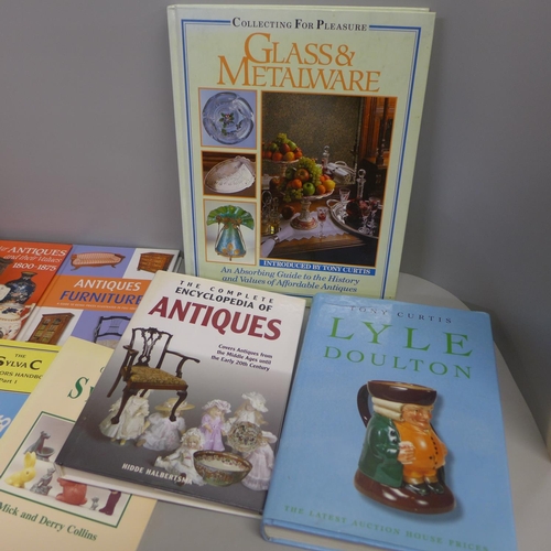 797 - A collection of books including antiques guides, Moorcroft, Sylvac, etc.