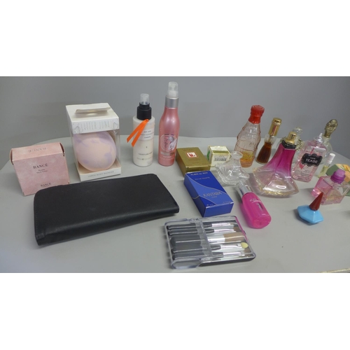 799 - A collection of perfumes and cosmetic items