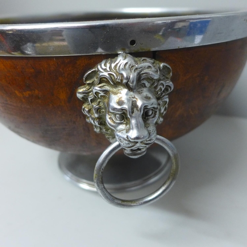 839 - A carved oak punch bowl with lion mask handles and metal base, (no liner)