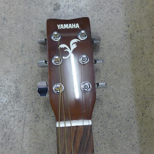 843 - A Yamaha F310 guitar (one string missing)