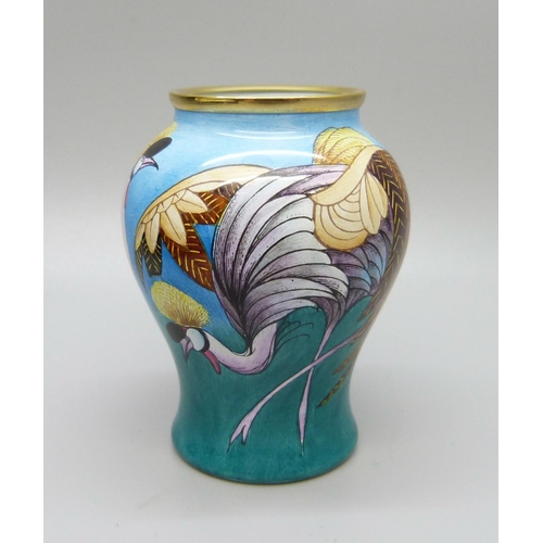 875 - A Moorcroft miniature enamel vase