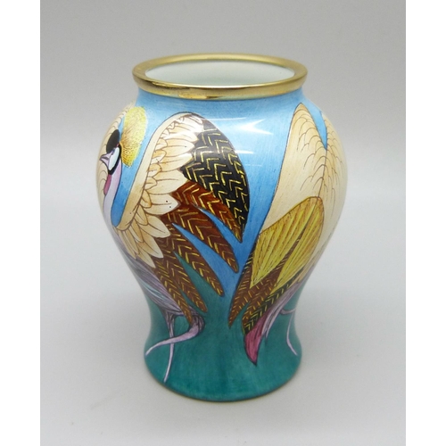 875 - A Moorcroft miniature enamel vase