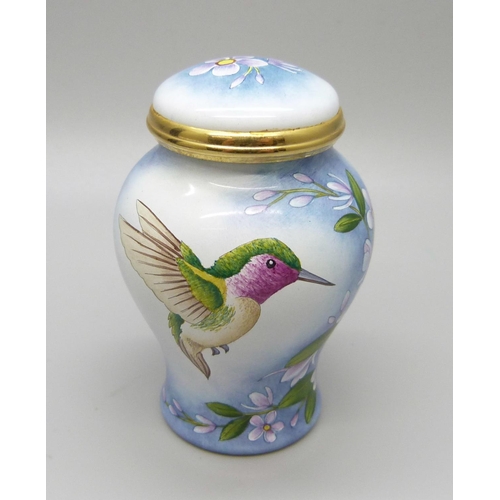 879 - A Moorcroft miniature enamel lidded vase