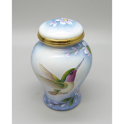 879 - A Moorcroft miniature enamel lidded vase