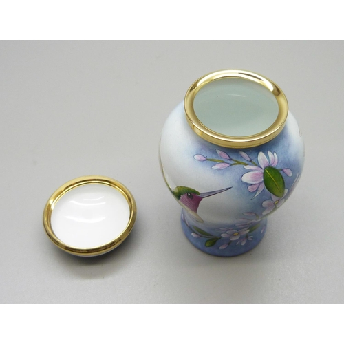 879 - A Moorcroft miniature enamel lidded vase