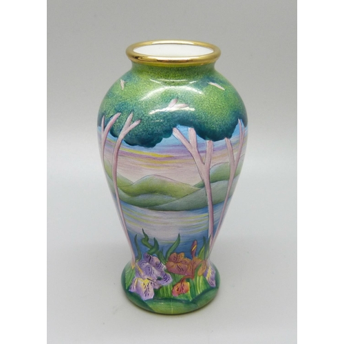 883 - A Moorcroft miniature enamel vase