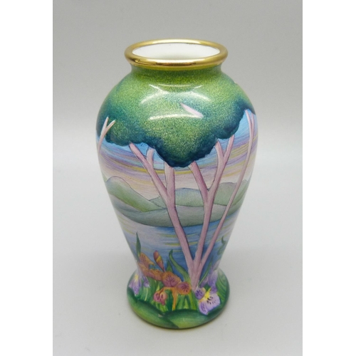 883 - A Moorcroft miniature enamel vase