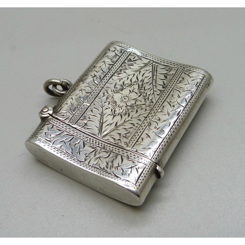 908 - A silver vesta case, engraved decoration, Chester 1904