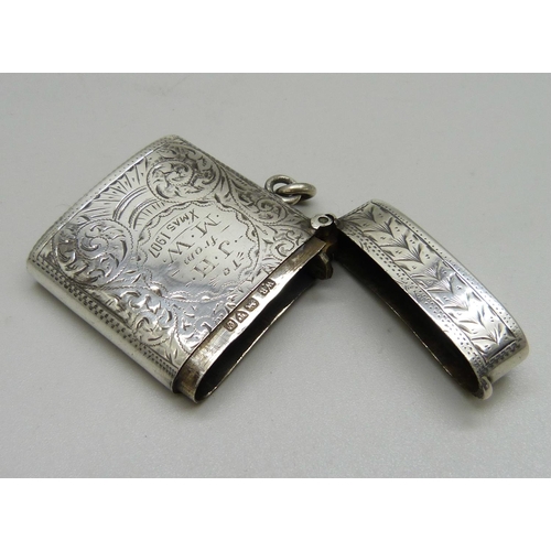 908 - A silver vesta case, engraved decoration, Chester 1904