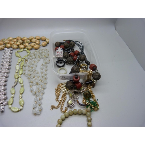 935 - A small box of costume jewellery