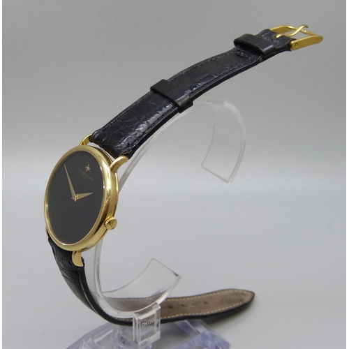 965 - An 18ct gold Vacheron & Constantin Geneve dress wristwatch, the 33mm case marked 520950, on a black ... 