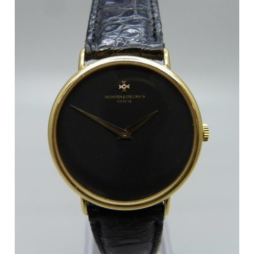 965 - An 18ct gold Vacheron & Constantin Geneve dress wristwatch, the 33mm case marked 520950, on a black ... 