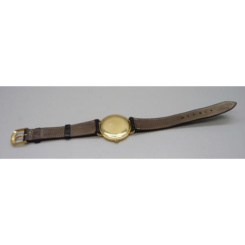 965 - An 18ct gold Vacheron & Constantin Geneve dress wristwatch, the 33mm case marked 520950, on a black ... 