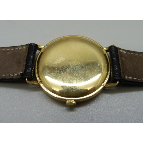 965 - An 18ct gold Vacheron & Constantin Geneve dress wristwatch, the 33mm case marked 520950, on a black ... 