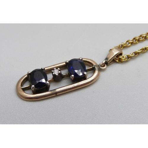 966 - A yellow metal, sapphire and diamond pendant on a 9ct gold chain, total weight 5.6g, chain 43cm