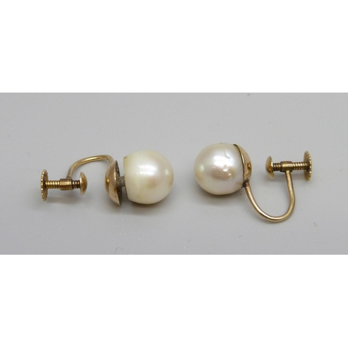 971 - A pair of 9ct gold mounted screw back pearl earrings, approximately 8mm, (one requires repair)